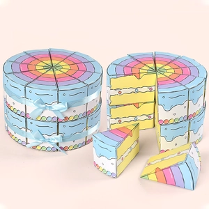 Rainbow cake slice gift boxes for parties featuring colorful triangular packaging design