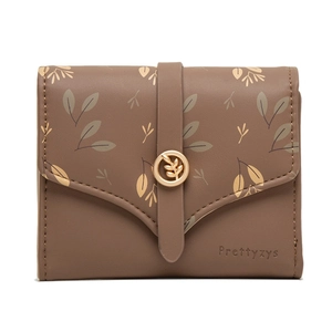 Detail of brown PU leather wallet with leaf print and golden leaf metal buckle