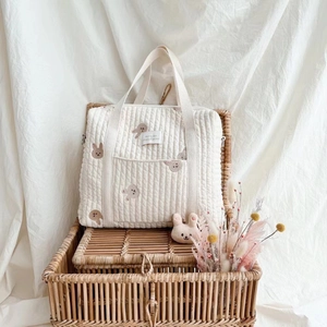 Cream quilted cotton mommy tote bag with animal embroidery and shoulder strap