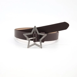 Detail of a dark brown leather belt featuring a silver star-shaped buckle with rhinestones