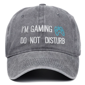 Dark grey washed cotton baseball cap with Gaming Do Not Disturb embroidery and gamepad icon