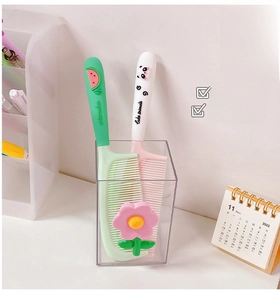 Close-up of cute cartoon hairbrushes in watermelon and panda themes with soft grips