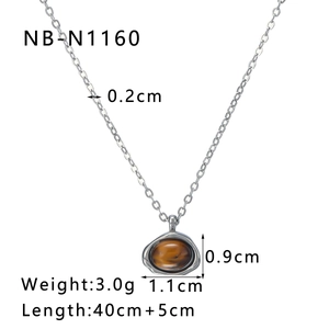 Detailed view of silver stainless steel necklace with brown oval tiger eye stone pendant