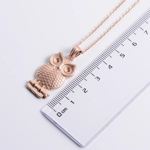 Rose gold owl pendant necklace with textured grid design and size measurement view