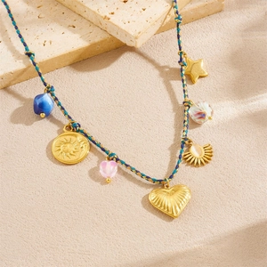 Bohemian hand-woven cord necklace with gold star and heart pendants on stone base