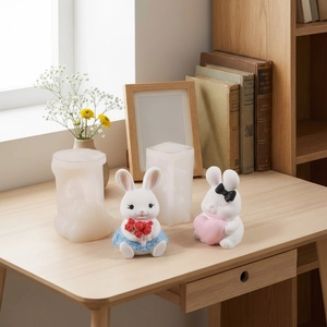 DIY silicone mold for cute rabbit candles holding flowers and hearts decorations