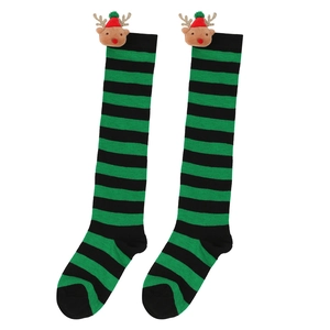 Detail of Christmas knee-high socks featuring green stripes and 3D plush reindeer dolls
