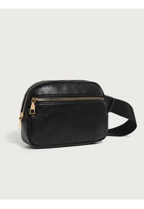 Detail of black pebbled leather waist bag showing gold zippers and adjustable strap
