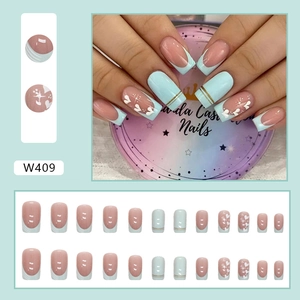 French tip press-on nails with gold foil, heart patterns and blue accents, 24-piece set
