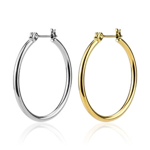 Detailed close-up of polished gold and silver hoop earrings with high-gloss mirror finish