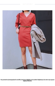 Detail of slim olive green woven leather belt on red dress with metallic buckle