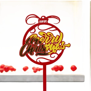 Red acrylic Merry Christmas cake topper with gold lettering and festive bow design