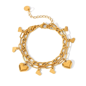 Close-up of gold layered heart pendant bracelet with lobster clasp and extension chain