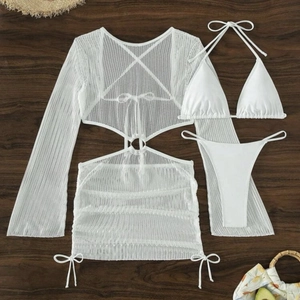 Three-piece white hollow knit bikini set with drawstring cover-up on wood background