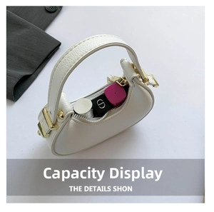 Detail view of white pebbled leather bag interior showing capacity for lipsticks