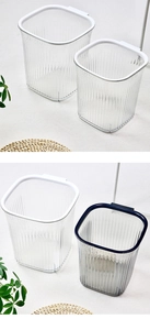 Close-up of luxury transparent striped square trash bins in white and deep blue finishes