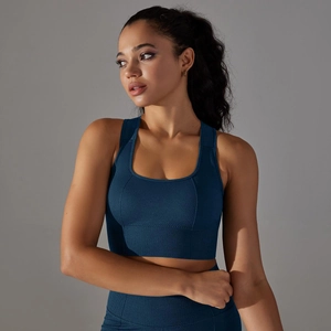 Close-up of navy blue seamless sports bra with U-neckline and breathable knit texture