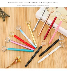 Close-up of metal ballpoint pens with large heart-shaped crystals in eleven colors