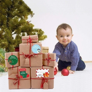 Christmas gift labels on kraft boxes with festive motifs like snowmen and reindeer