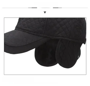 Detail view of winter baseball cap with plush ear flaps and warm quilted fabric