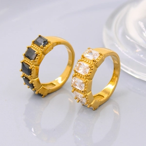 Elegant gold titanium steel ring with black and white zircon gemstones in minimalist design