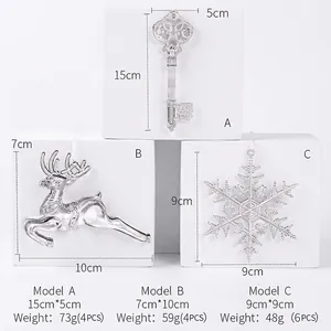 Transparent acrylic Christmas tree ornaments featuring reindeer, snowflakes and vintage keys