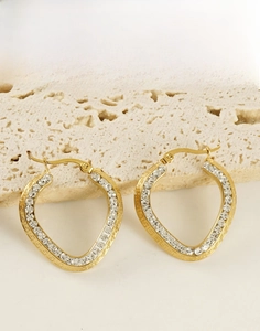 Detail of 18K gold plated hoop earrings with zircon pavé and Greek key patterns