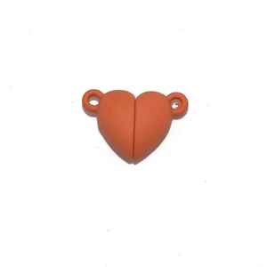 Detail of matte dark orange heart magnetic clasp connector for DIY couple jewelry projects