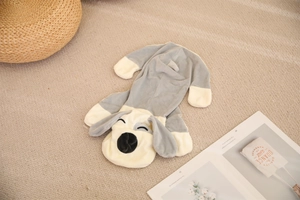 Flat lay of soft plush dog case with cute sleeping expression on a cozy home rug
