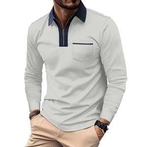 Close-up of light gray long-sleeve polo shirt with navy chest pocket and zipper detail