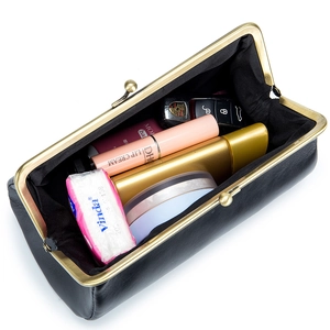 Classic black leather clutch bag with gold metal frame showing internal storage capacity
