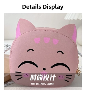Detailed close-up of pink cat crossbody bag showing lychee leather texture and white strap