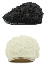 Detailed shot of black and beige lace berets featuring delicate 3D floral embellishments