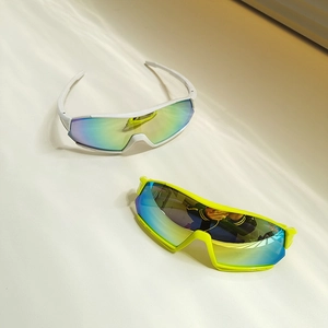 Detail of white and neon yellow punk kids' sports sunglasses with mirrored lenses