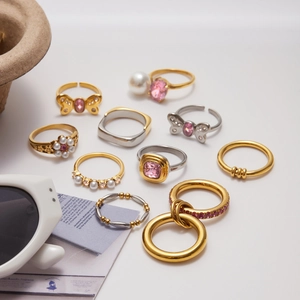 Fashionable gold and silver stainless steel rings set with pink zircon and pearls