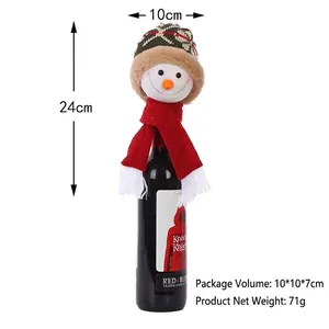 Detailed view of snowman wine bottle cover with knit hat and scarf measuring 24cm in height