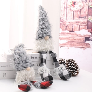 Close-up of plush Christmas gnomes in grey and white with festive checkered fabric legs