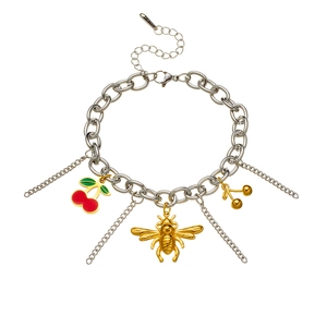 Stainless steel chain bracelet with gold bee and cherry charms on white background