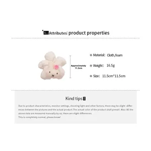Detailed view of plush rabbit hair tie with dimensions 11.5cm on a white background