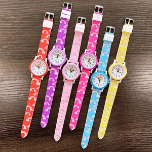 Flat lay of six colorful silicone children's watches with rainbow and cloud print