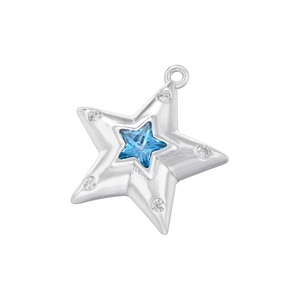 Detailed view of silver star pendant with blue gemstone and clear zircon accents