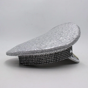 Detail of silver captain hat with sparkling sequins and rhinestone bands for party wear