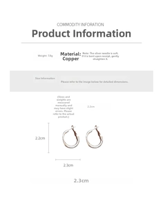 Detail of silver C-shape hoop earrings showing 2.3cm width and copper material texture