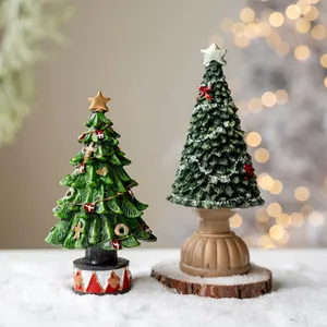Miniature resin Christmas tree tabletop ornaments with circus style base in snow scene