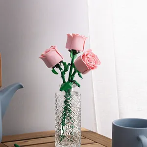 Pink building block roses in a crystal glass vase for home decor and romantic gifting