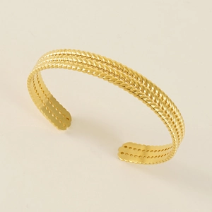 Minimalist gold braided stainless steel open bangle with a triple-layer twisted design