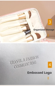 Close-up of silver cosmetic bag featuring makeup brush slots and pink interior lining