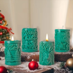 Set of four green Christmas silicone candle molds with embossed festive designs