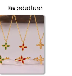 Detail of 18k gold plated clover jewelry sets with emerald, ruby, and zircon stones