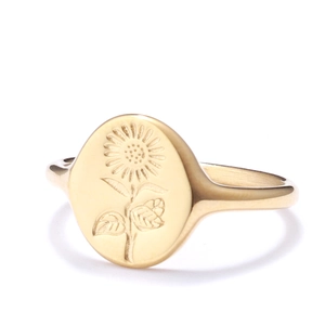 Polished gold signet ring featuring a detailed sunflower relief on an oval face